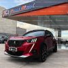 peugeot-2008-gt-ta-automatico-2022-rojo-full-1.2t-4x2-techo-panoramico-crossover-suv-gasolina-halogenos-neblineros-aros-deportivos-peugeot-r18-retrovisores-electricos-abatibles-retrovisores-con-direccionales-faros-led-sensores-de-parqueo-doble-toma-de-escape-asientos-de-cuero-aleron-mandos-de-audio-al-volante-mandos-de-velocidad-al-volante-pantalla-doble-dim-camara-de-retro-velocidad-crucero-paletas-de-cambios-al-volante-volante-deportivo-gt-acabados-de-fibra-de-carbono-en-puertas-y-tablero-freno-de-mano-electronico-modos-de-manejo-aire-acondicionado-bizona-6-airbags-sensores-de-cinturones-4-vidrios-y-retrovisores-electricos