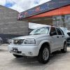chevrolet-grand-vitara-dlx-4x2-tm-manual-full-blanco-2008-suv-todo-terreno-gasolina-2.0-aire-acondicionado-parrilla-halogenos-neblineros-aros-deportivos-vidrios-tinturados-4-vidrios-electricos-retrovisores-electricos-alarma-bloqueo-central-chevy-radio-original-cd-mp3-2008-blanco